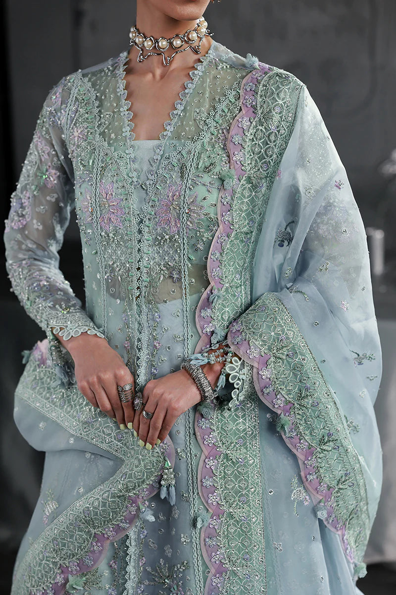 Model wearing MF-08 Serene Aqua by Qalamkar in aqua blue hand-embroidered dress – Pakistani luxury pret perfect for festive wear, shop online in UK.