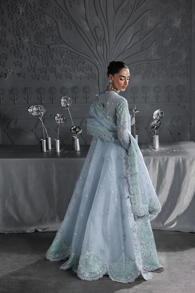 Model wearing MF-08 Serene Aqua by Qalamkar in aqua blue hand-embroidered dress – Pakistani luxury pret perfect for festive wear, shop online in UK.
