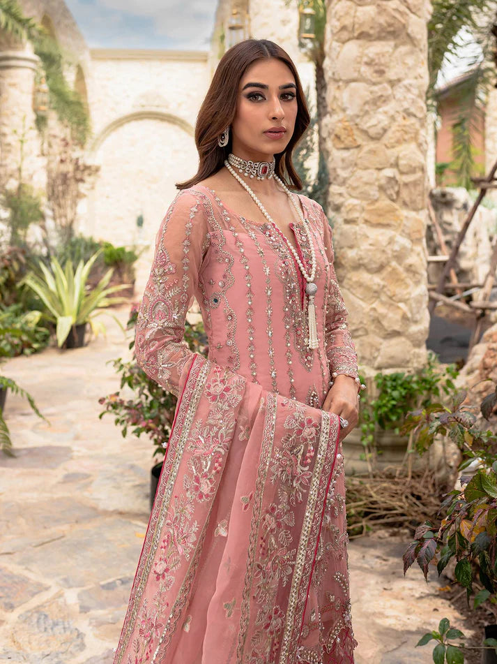 Model wearing soft pink Aethira GL-LP-V1-01 from Gulaal, featuring detailed embellishments—Pakistani luxury pret clothes online in UK.