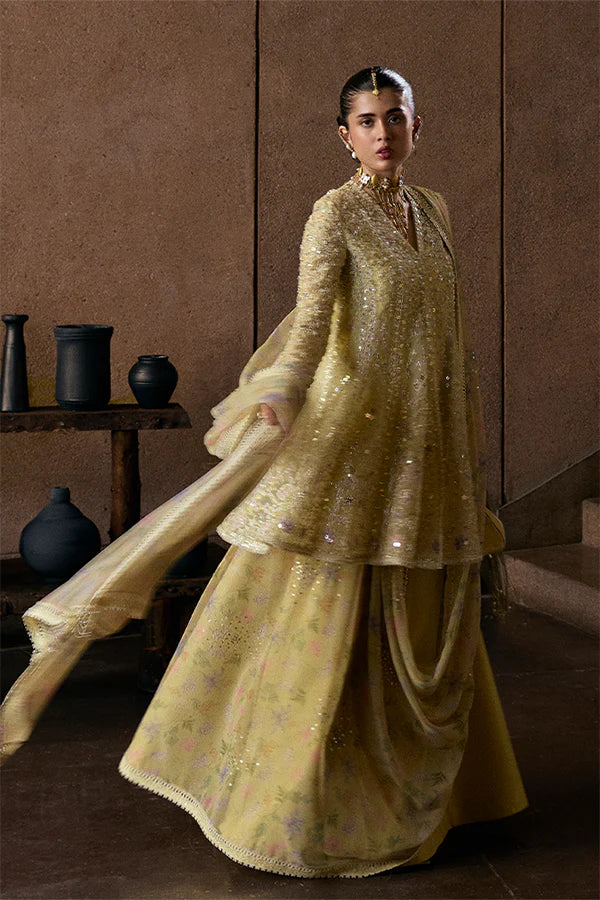 Model wearing pastel yellow embellished ensemble from Suffuse Merivah, Pakistani luxury pret, shop Pakistani clothes online in UK