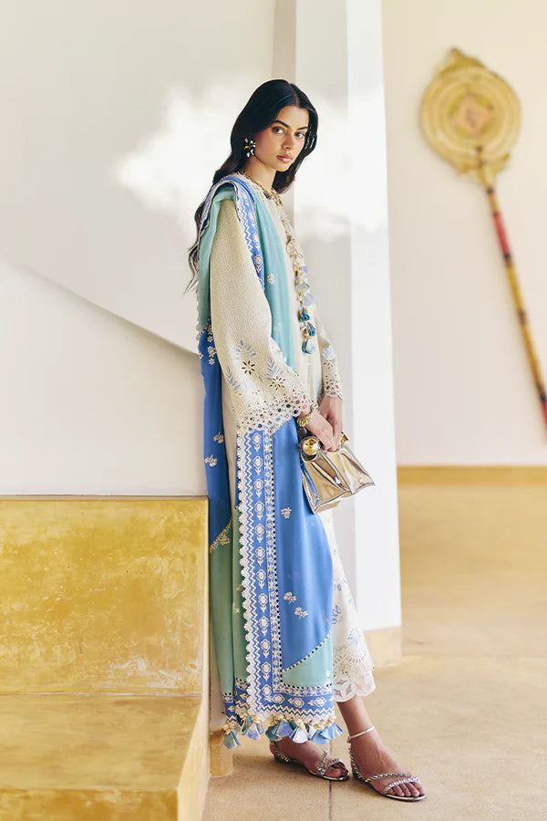 Model wearing off-white embroidered dress with blue printed dupatta from Suffuse Casual Pret 2025 Danae. Pakistani luxury pret in UK.