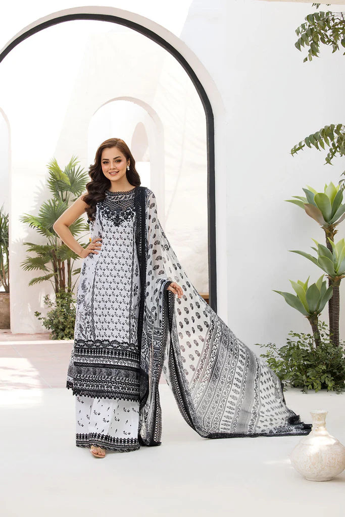 Model wearing Sobia Nazir Vital 2025 Design 10A in black and white with intricate prints. Shop Pakistani luxury pret and Pakistani clothes online in UK.