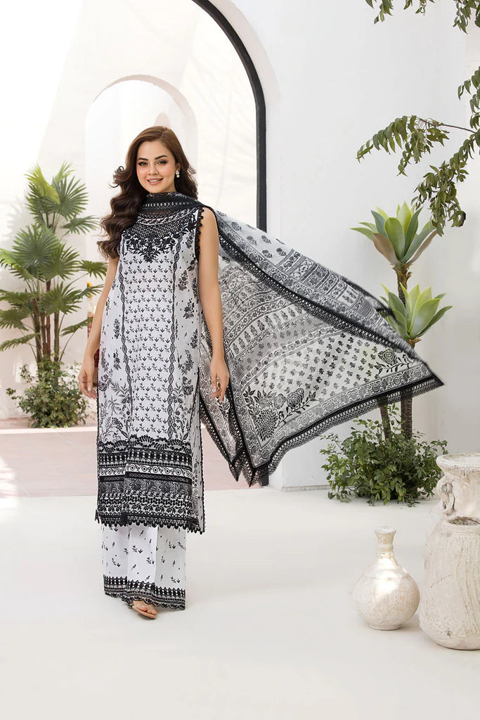 Model wearing Sobia Nazir Vital 2025 Design 10A in black and white with intricate prints. Shop Pakistani luxury pret and Pakistani clothes online in UK.