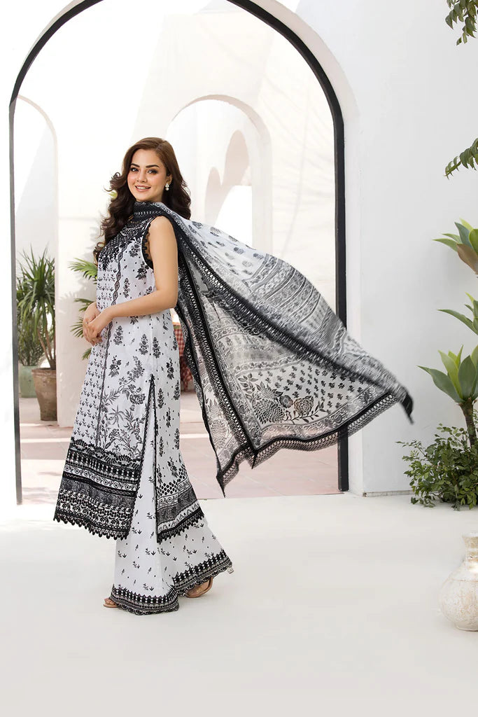 Model wearing Sobia Nazir Vital 2025 Design 10A in black and white with intricate prints. Shop Pakistani luxury pret and Pakistani clothes online in UK.