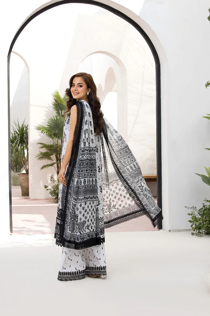 Model wearing Sobia Nazir Vital 2025 Design 10A in black and white with intricate prints. Shop Pakistani luxury pret and Pakistani clothes online in UK.