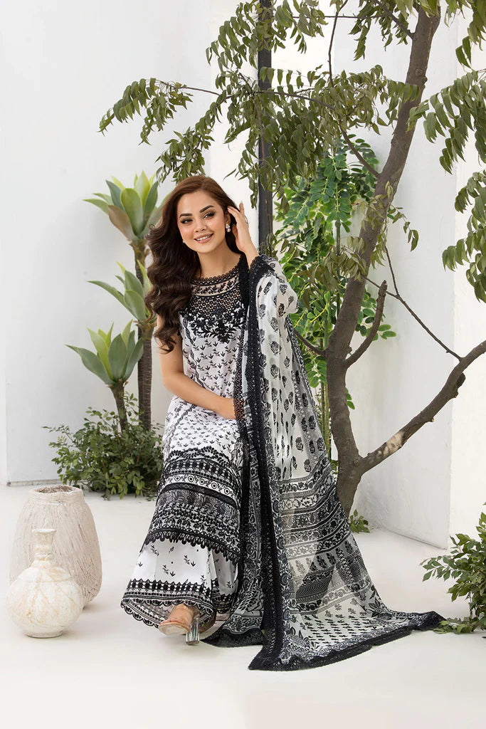 Model wearing Sobia Nazir Vital 2025 Design 10A in black and white with intricate prints. Shop Pakistani luxury pret and Pakistani clothes online in UK.