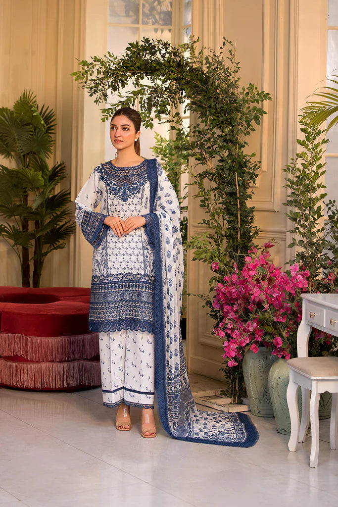 Model wearing Sobia Nazir Vital 2025 Design 10B in white and navy with intricate blue embroidery. Shop Pakistani luxury pret in UK.