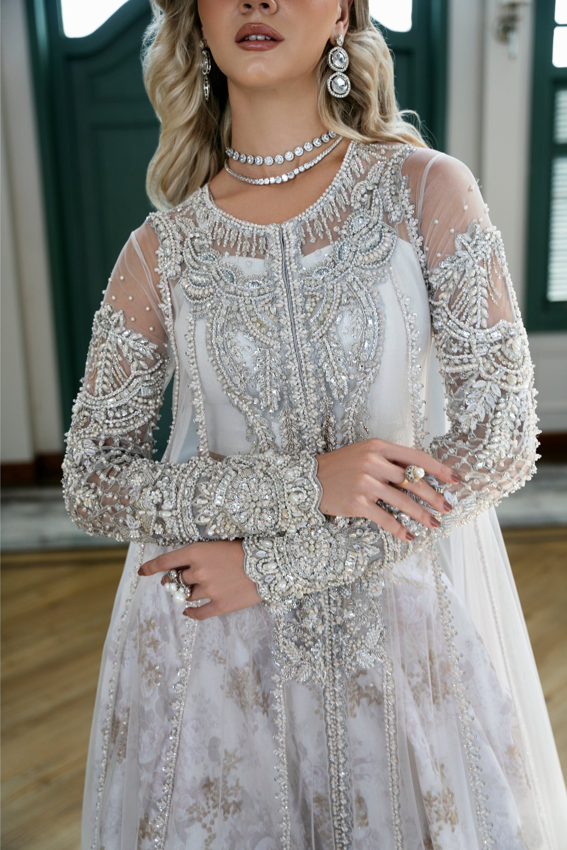 Model wearing Snowdrop from Mysie by Tahira, a stunning white and silver luxury pret outfit, perfect for Pakistani clothes in the UK.