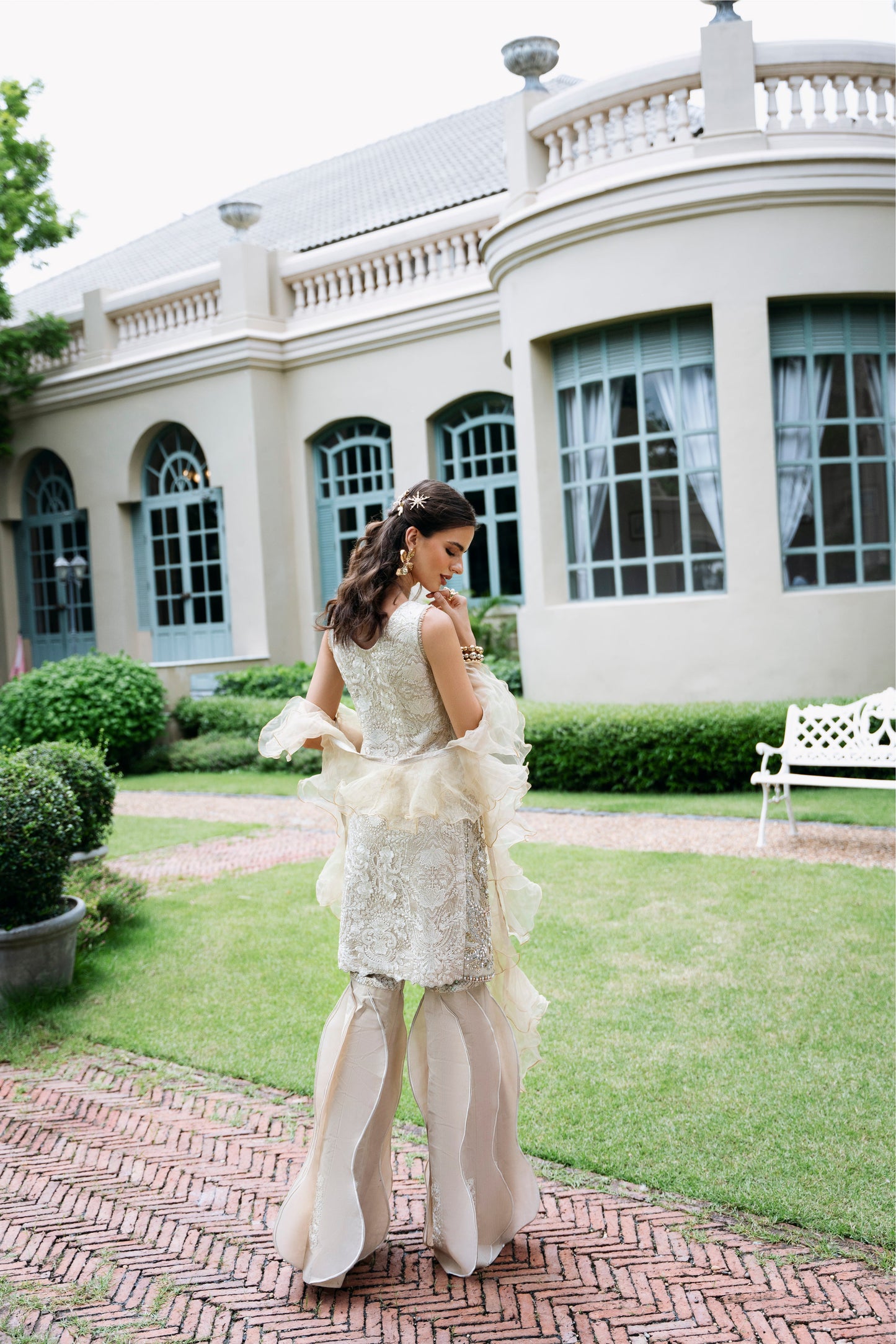 Model wearing Fifi from Mysie by Tahira, a beige embellished outfit with flared pants, perfect for Pakistani luxury pret in the UK.
