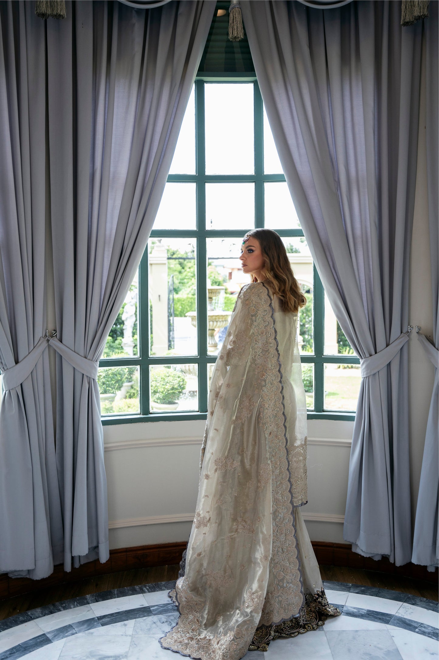 Model wearing Arya from Mysie by Tahira in beige with intricate embellishments, perfect for Pakistani luxury pret in the UK.