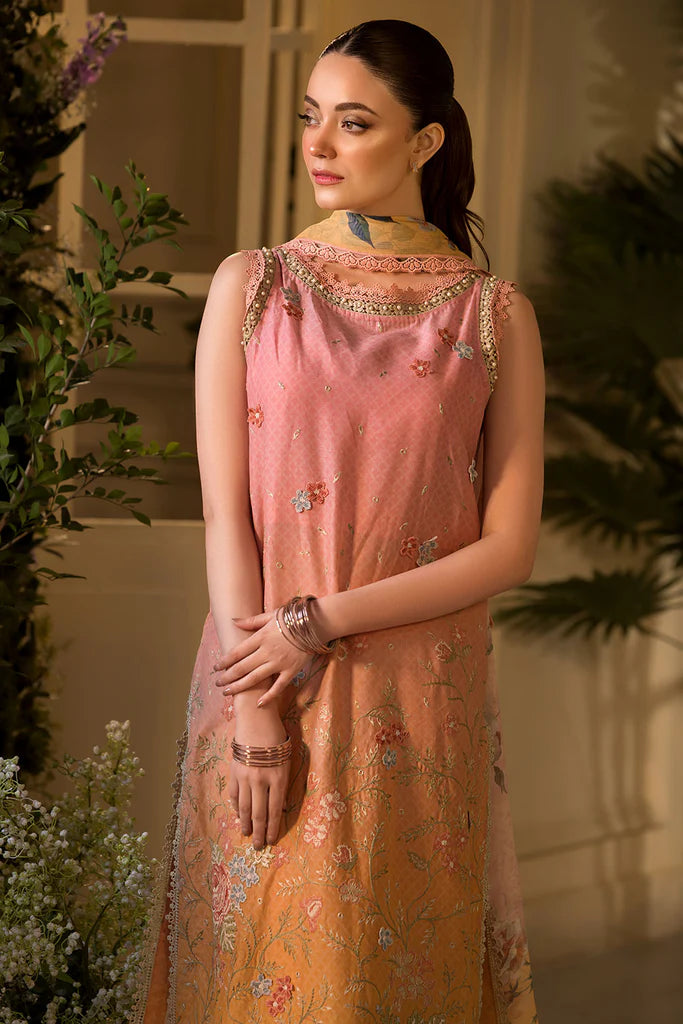 Model wearing peach and yellow embroidered dress from Sobia Nazir Vital 2025 Design 11B. Pakistani luxury pret clothes online in UK.