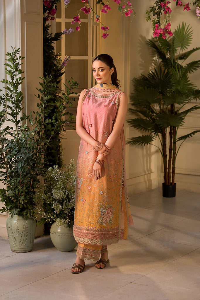 Model wearing peach and yellow embroidered dress from Sobia Nazir Vital 2025 Design 11B. Pakistani luxury pret clothes online in UK.