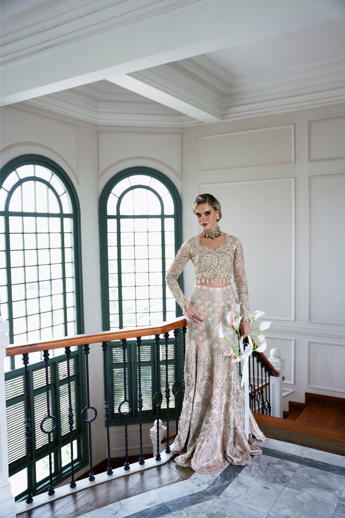 Model wearing soft pastel pink and gold embellished lehenga MALISA from Mysie by Tahira, Pakistani luxury pret available online in UK.