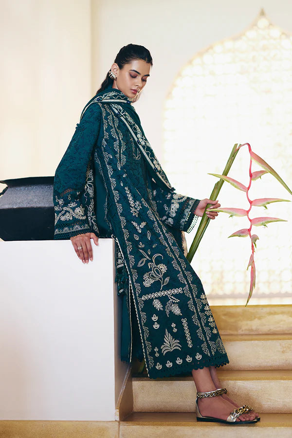 Model wearing peacock green embroidered dress from Suffuse Casual Pret 2025 Ivera. Pakistani luxury pret and Pakistani clothes online in UK.