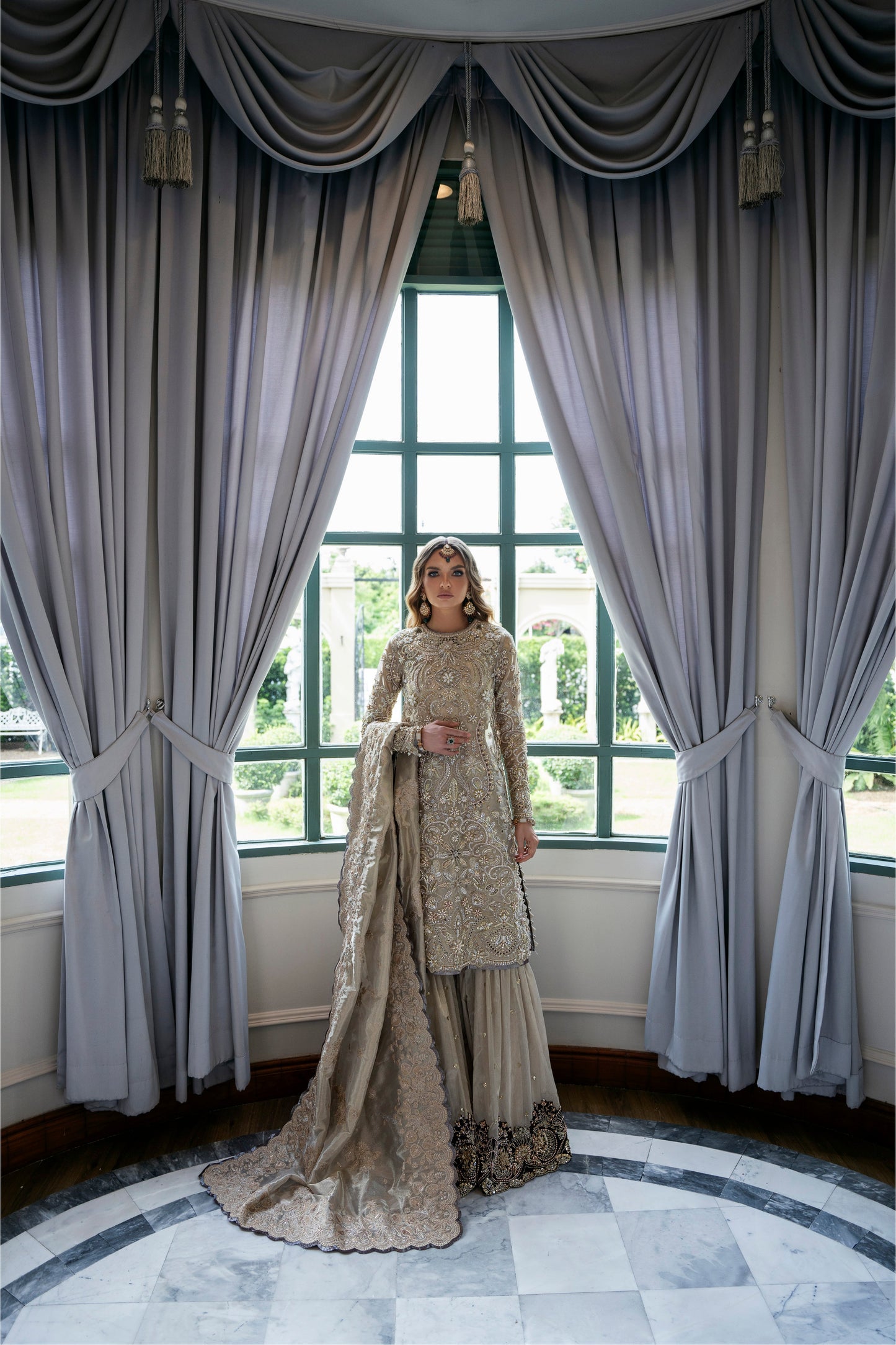 Model wearing Arya from Mysie by Tahira in beige with intricate embellishments, perfect for Pakistani luxury pret in the UK.