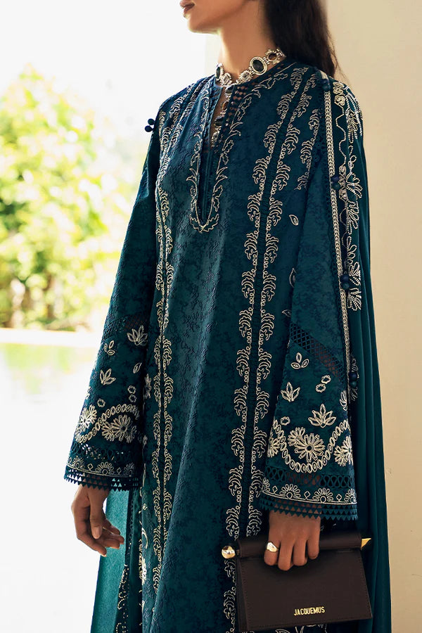 Model wearing peacock green embroidered dress from Suffuse Casual Pret 2025 Ivera. Pakistani luxury pret and Pakistani clothes online in UK.