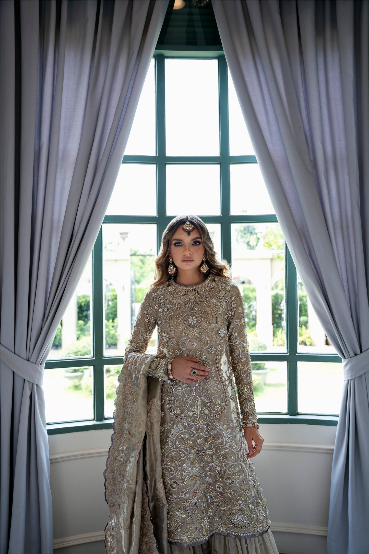 Model wearing Arya from Mysie by Tahira in beige with intricate embellishments, perfect for Pakistani luxury pret in the UK.