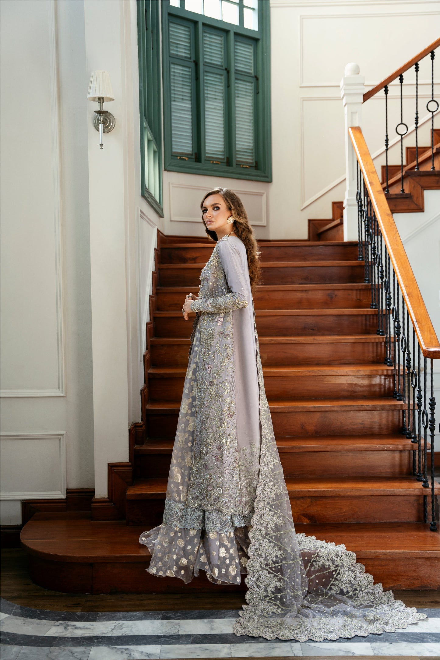 Model wearing Lotus from Mysie by Tahira, a luxurious grey embellished lehenga choli perfect for Pakistani luxury pret in the UK.