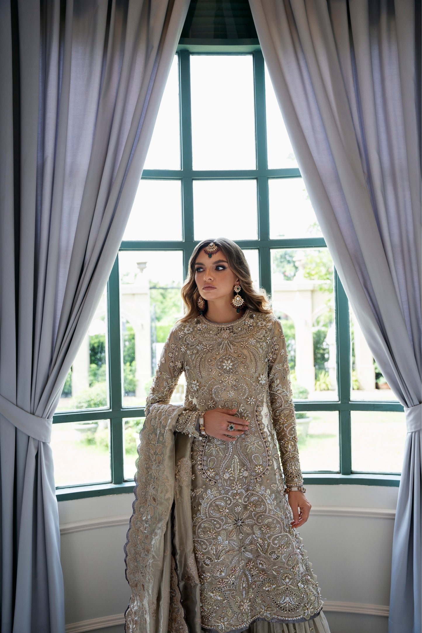 Model wearing Arya from Mysie by Tahira in beige with intricate embellishments, perfect for Pakistani luxury pret in the UK.