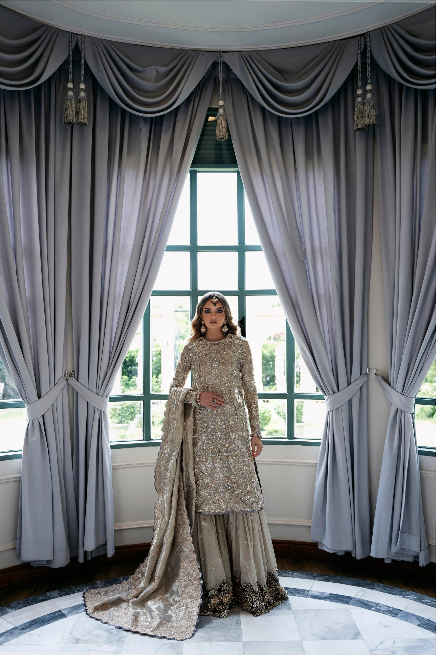 Model wearing Arya from Mysie by Tahira in beige with intricate embellishments, perfect for Pakistani luxury pret in the UK.