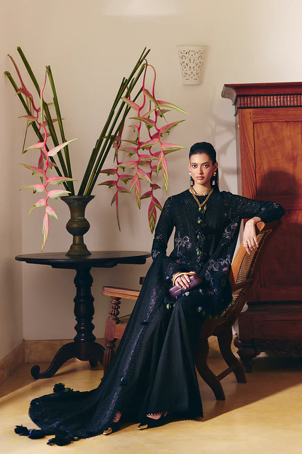 Model wearing black embroidered dress from Suffuse Casual Pret 2025 Leyla. Pakistani luxury pret and Pakistani clothes online in UK.