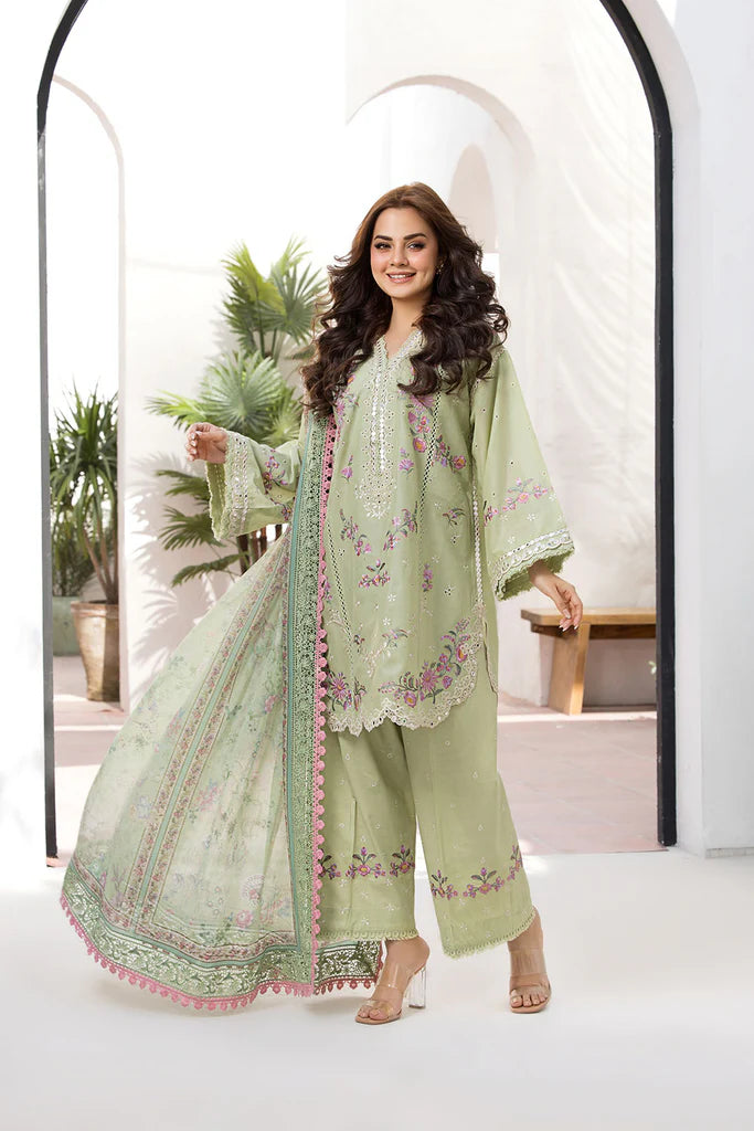Model wearing Sobia Nazir Vital 2025 Design 1A in pastel green with floral embroidery. Shop Pakistani luxury pret clothes online in UK.