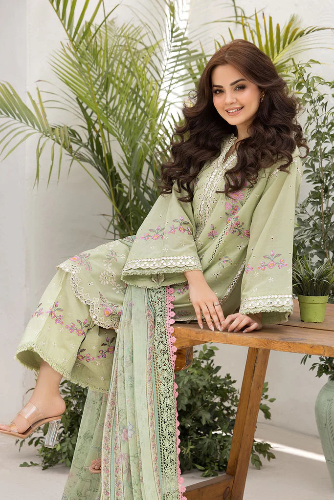 Model wearing Sobia Nazir Vital 2025 Design 1A in pastel green with floral embroidery. Shop Pakistani luxury pret clothes online in UK.