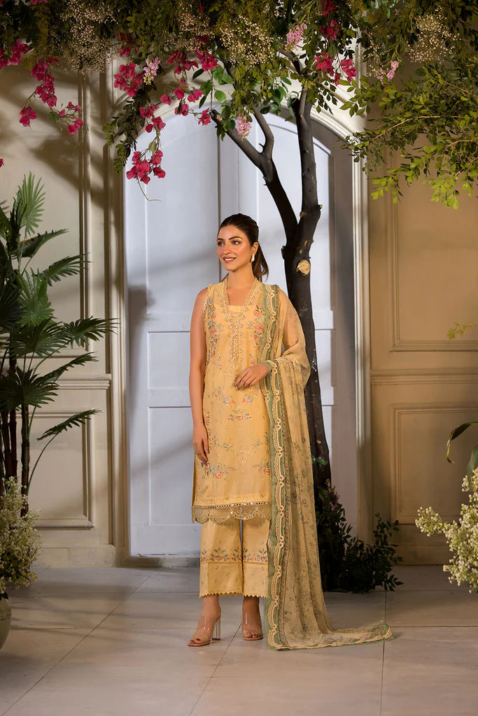 Model wearing Sobia Nazir Vital 2025 Design 1B in mustard yellow with embroidered detailing. Shop Pakistani luxury pret online in UK.