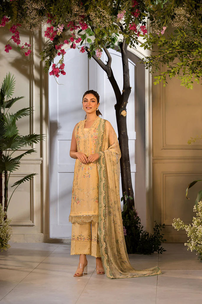Model wearing Sobia Nazir Vital 2025 Design 1B in mustard yellow with embroidered detailing. Shop Pakistani luxury pret online in UK.