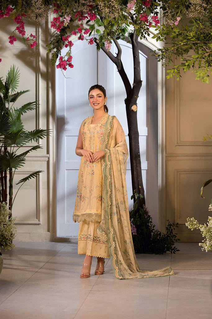 Model wearing Sobia Nazir Vital 2025 Design 1B in mustard yellow with embroidered detailing. Shop Pakistani luxury pret online in UK.