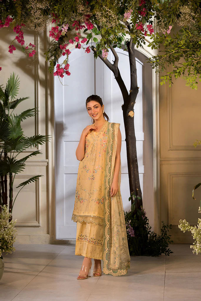 Model wearing Sobia Nazir Vital 2025 Design 1B in mustard yellow with embroidered detailing. Shop Pakistani luxury pret online in UK.