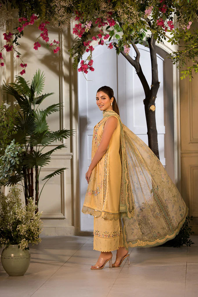 Model wearing Sobia Nazir Vital 2025 Design 1B in mustard yellow with embroidered detailing. Shop Pakistani luxury pret online in UK.