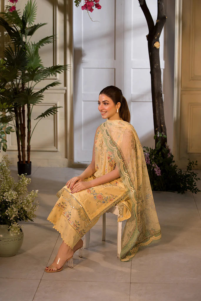 Model wearing Sobia Nazir Vital 2025 Design 1B in mustard yellow with embroidered detailing. Shop Pakistani luxury pret online in UK.