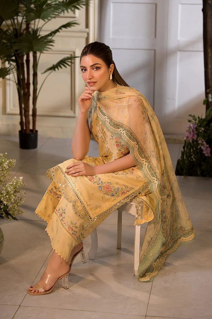 Model wearing Sobia Nazir Vital 2025 Design 1B in mustard yellow with embroidered detailing. Shop Pakistani luxury pret online in UK.