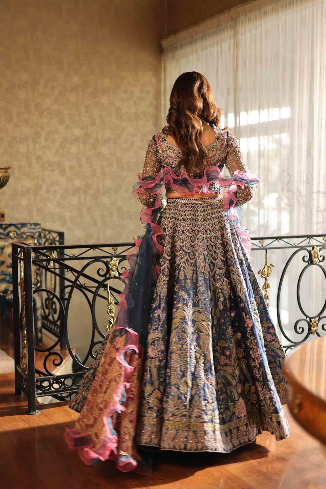 Model wearing blue and pink embellished lehenga choli Stella from Mysie By Tahira Wedding Edits '25, Pakistani luxury pret online in UK.