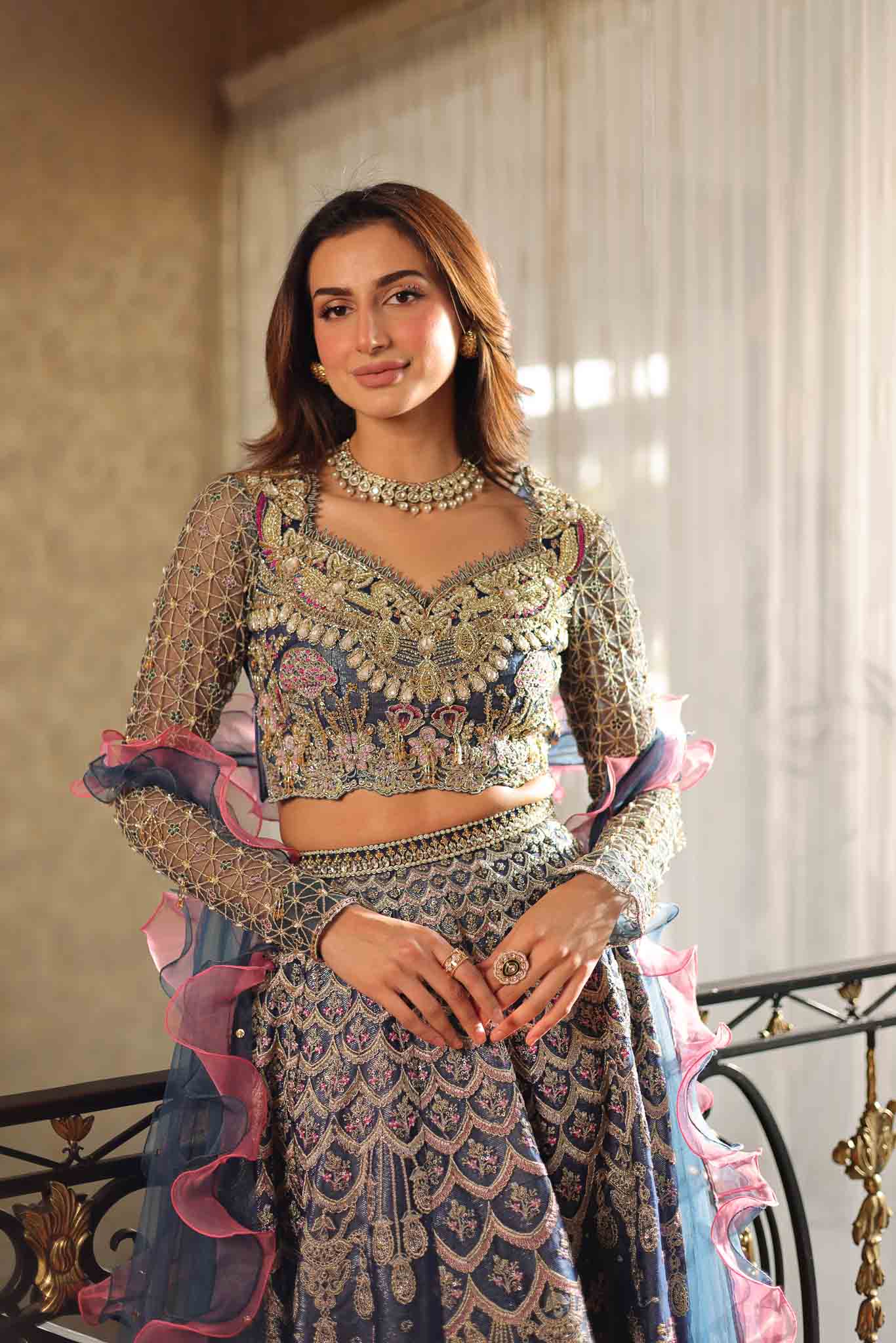 Model wearing blue and pink embellished lehenga choli Stella from Mysie By Tahira Wedding Edits '25, Pakistani luxury pret online in UK.