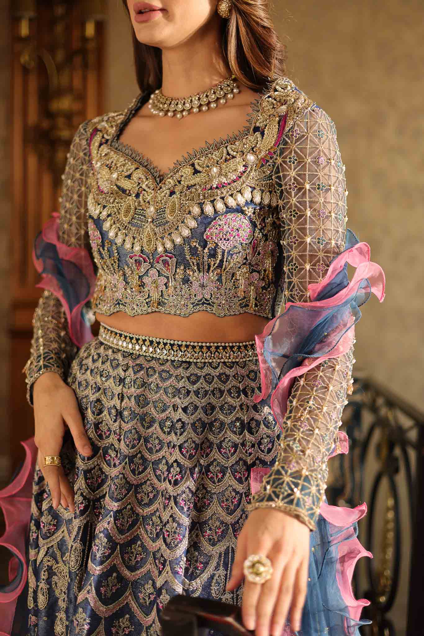 Model wearing blue and pink embellished lehenga choli Stella from Mysie By Tahira Wedding Edits '25, Pakistani luxury pret online in UK.