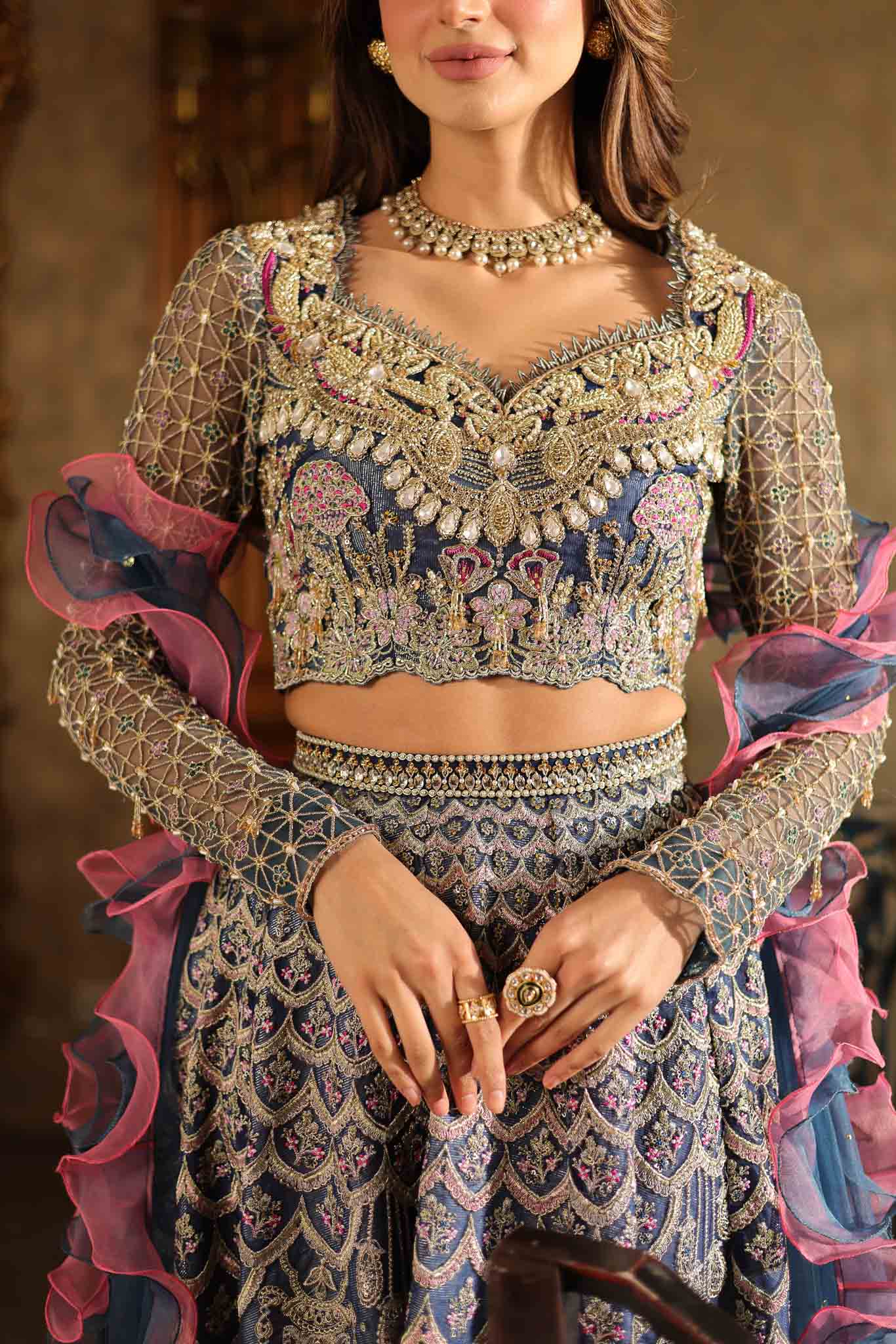 Model wearing blue and pink embellished lehenga choli Stella from Mysie By Tahira Wedding Edits '25, Pakistani luxury pret online in UK.