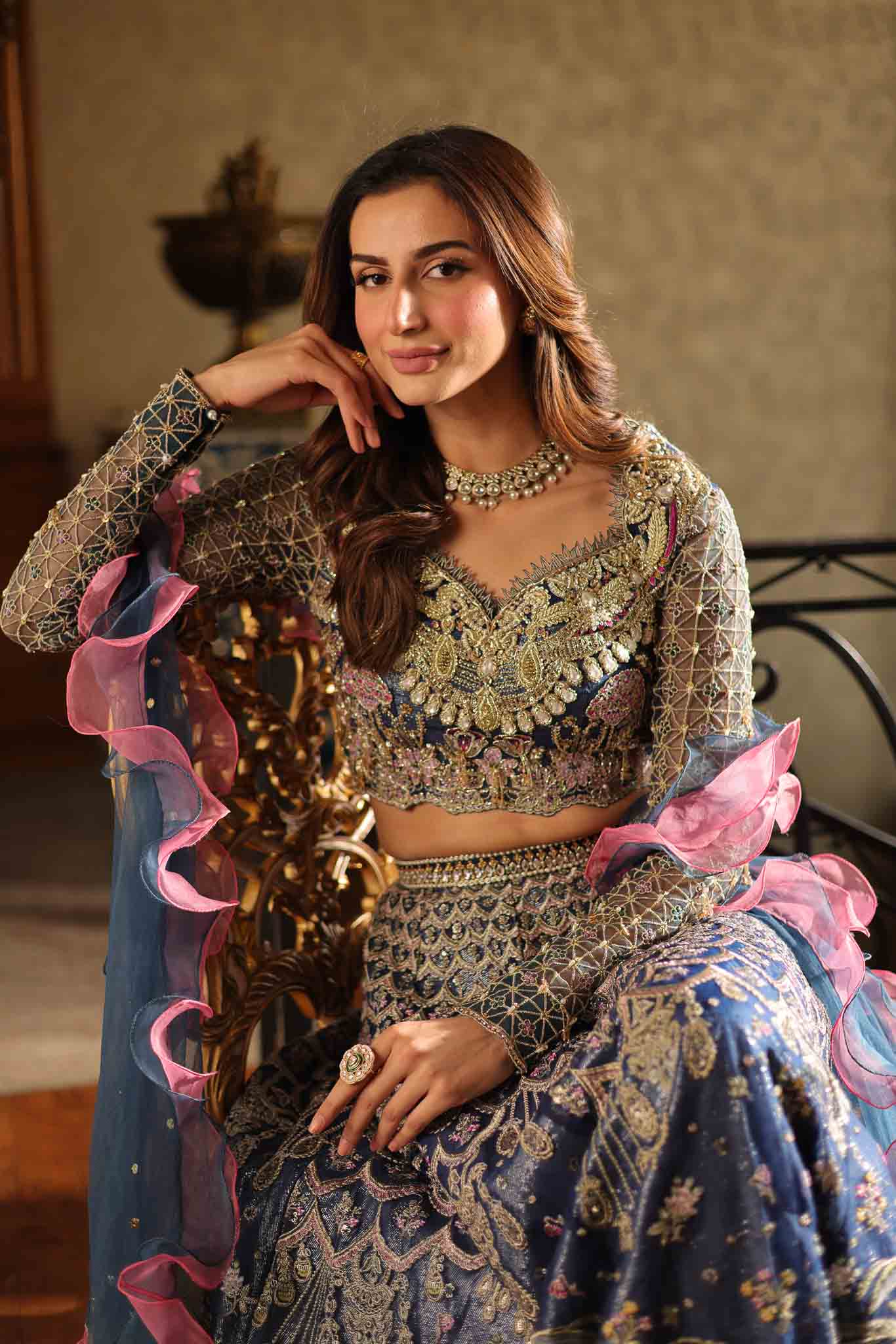 Model wearing blue and pink embellished lehenga choli Stella from Mysie By Tahira Wedding Edits '25, Pakistani luxury pret online in UK.