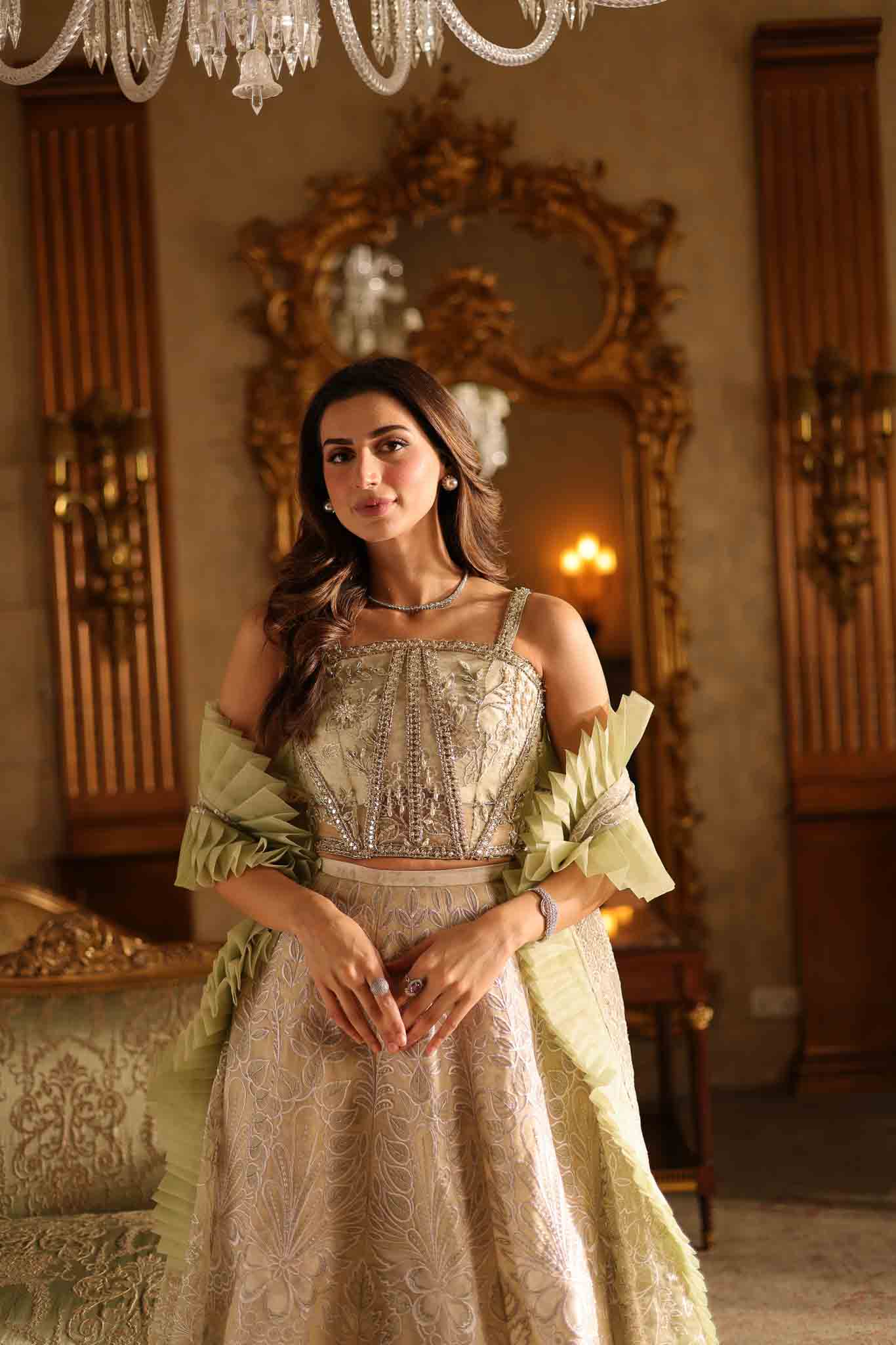 Model wearing beige and pastel green floor-length flared dress with ruffle accents from Mysie By Tahira's Esmera, Pakistani clothes online in UK.