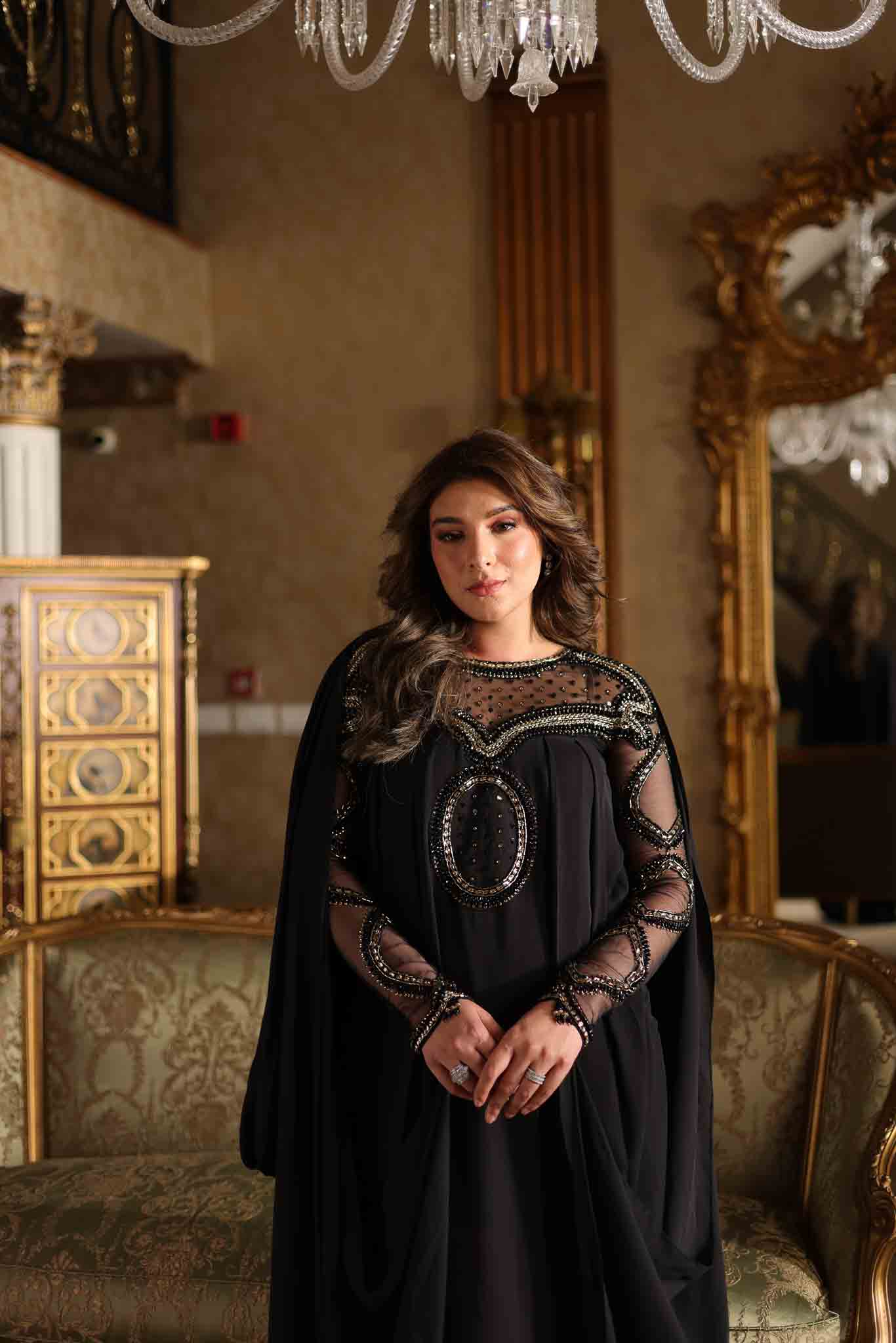 Model wearing black embellished kaftan-style dress with sheer detailing from Mysie By Tahira's Izara, Pakistani clothes online in UK.