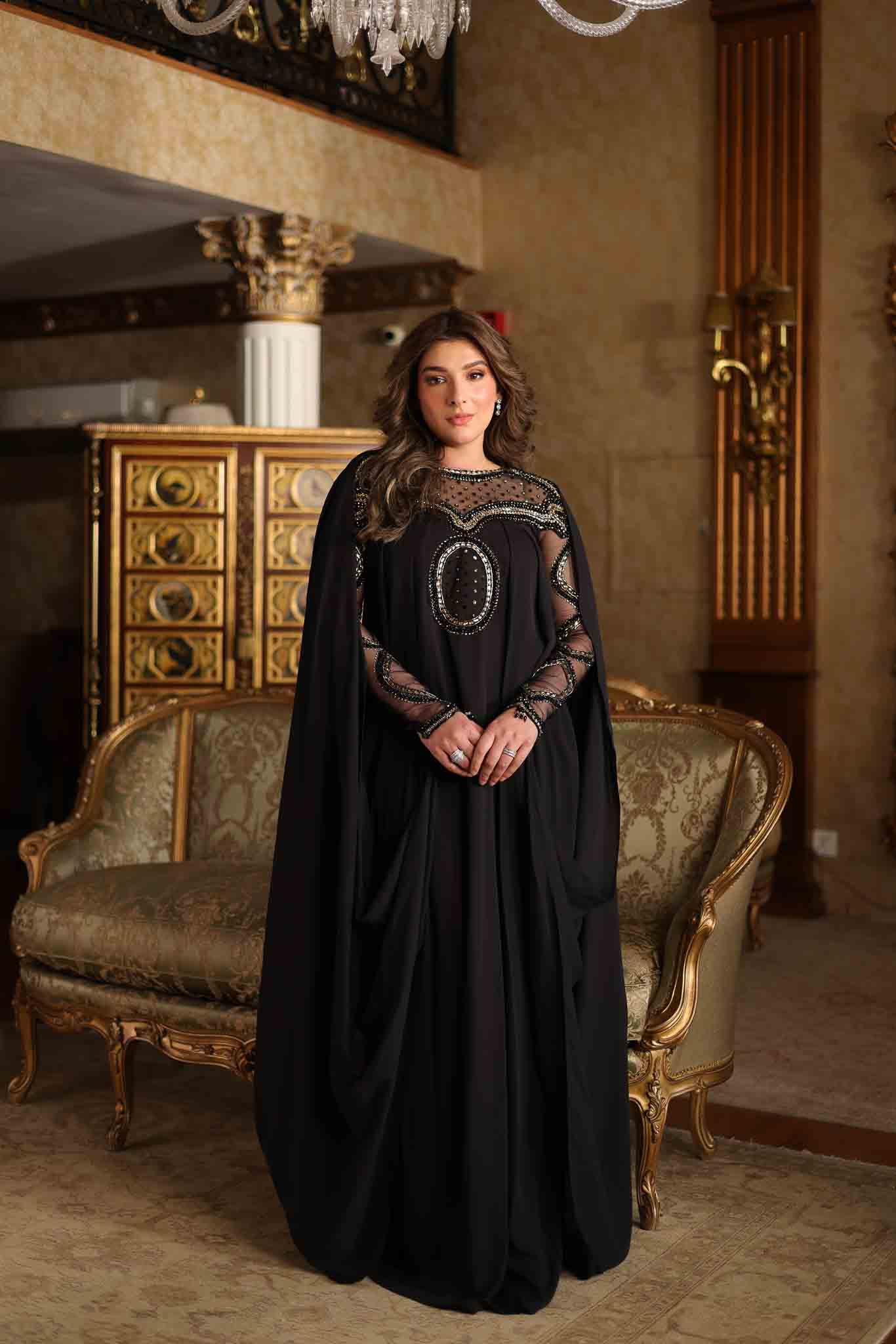 Model wearing black embellished kaftan-style dress with sheer detailing from Mysie By Tahira's Izara, Pakistani clothes online in UK.