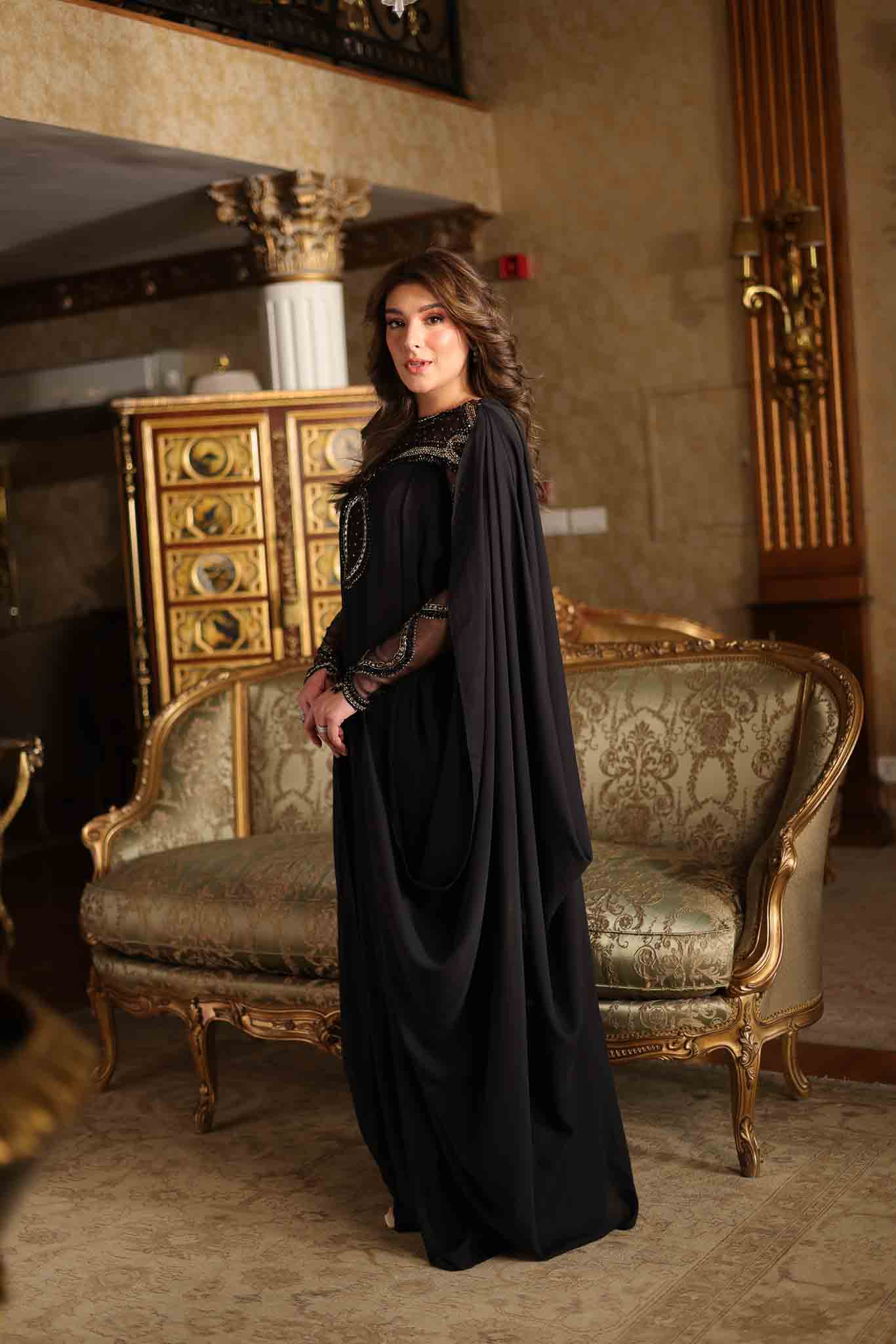 Model wearing black embellished kaftan-style dress with sheer detailing from Mysie By Tahira's Izara, Pakistani clothes online in UK.