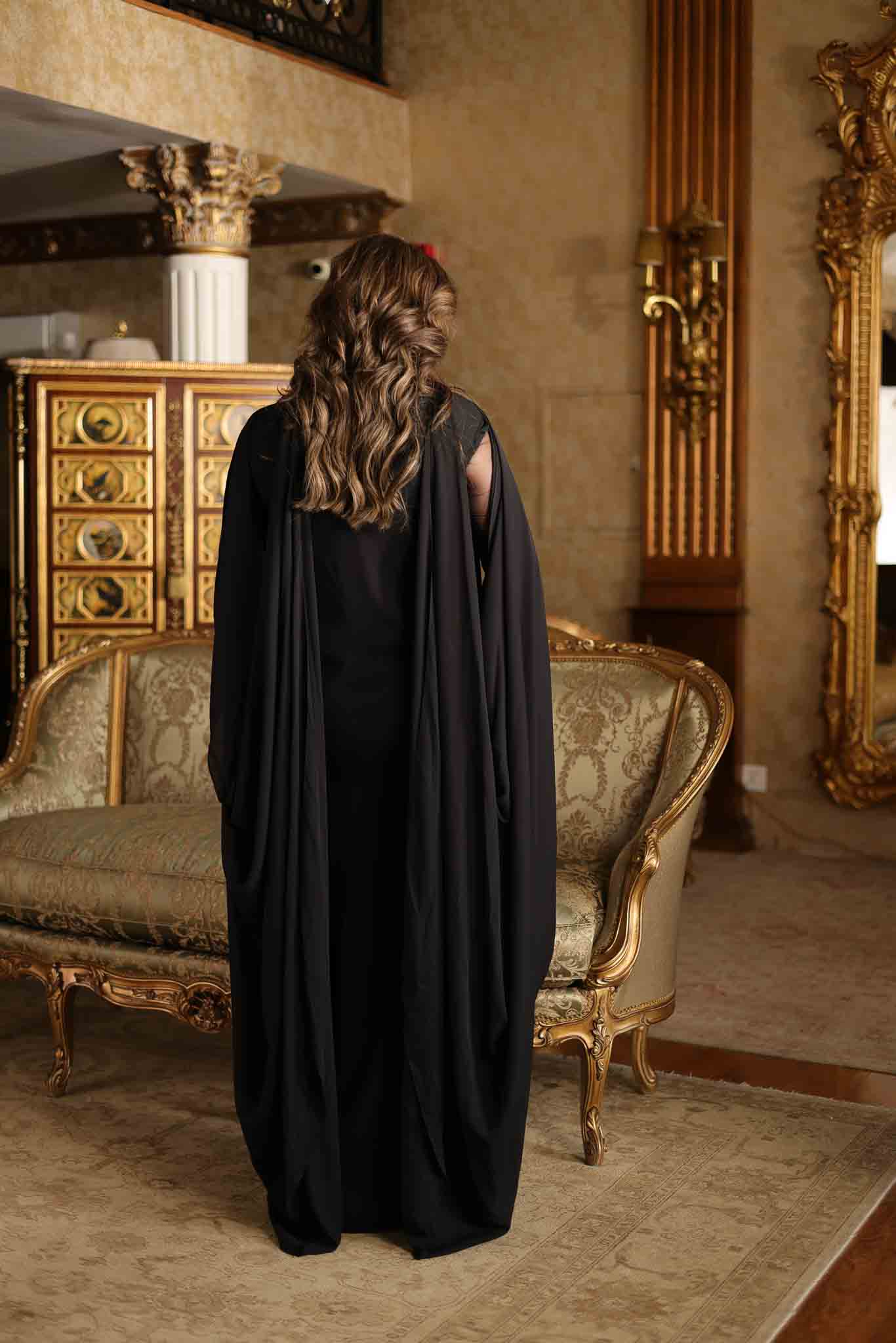 Model wearing black embellished kaftan-style dress with sheer detailing from Mysie By Tahira's Izara, Pakistani clothes online in UK.