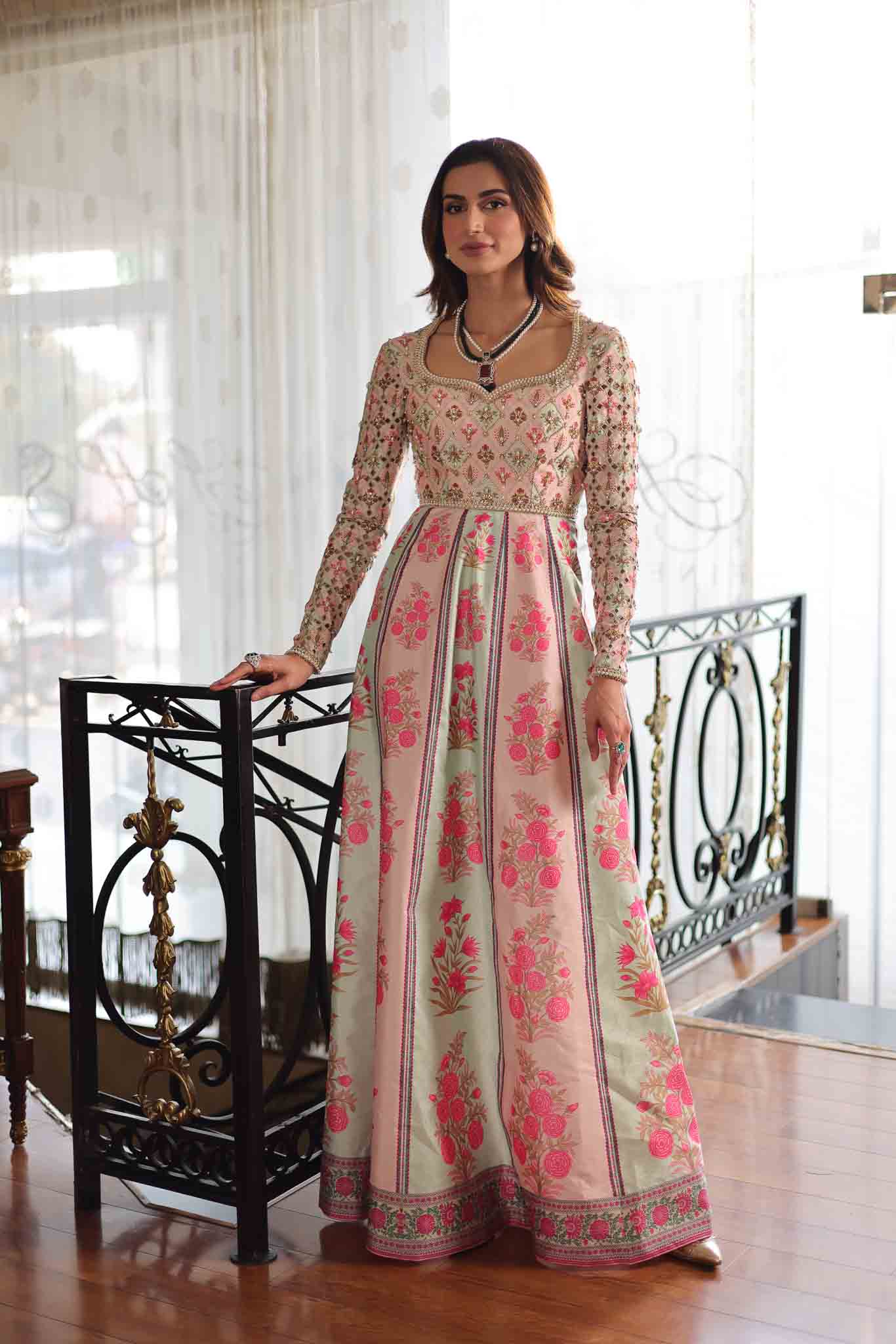 Model wearing pastel pink and ivory floral printed long dress from Mysie By Tahira's Gulabo, Pakistani Luxury pret and clothes online in UK.