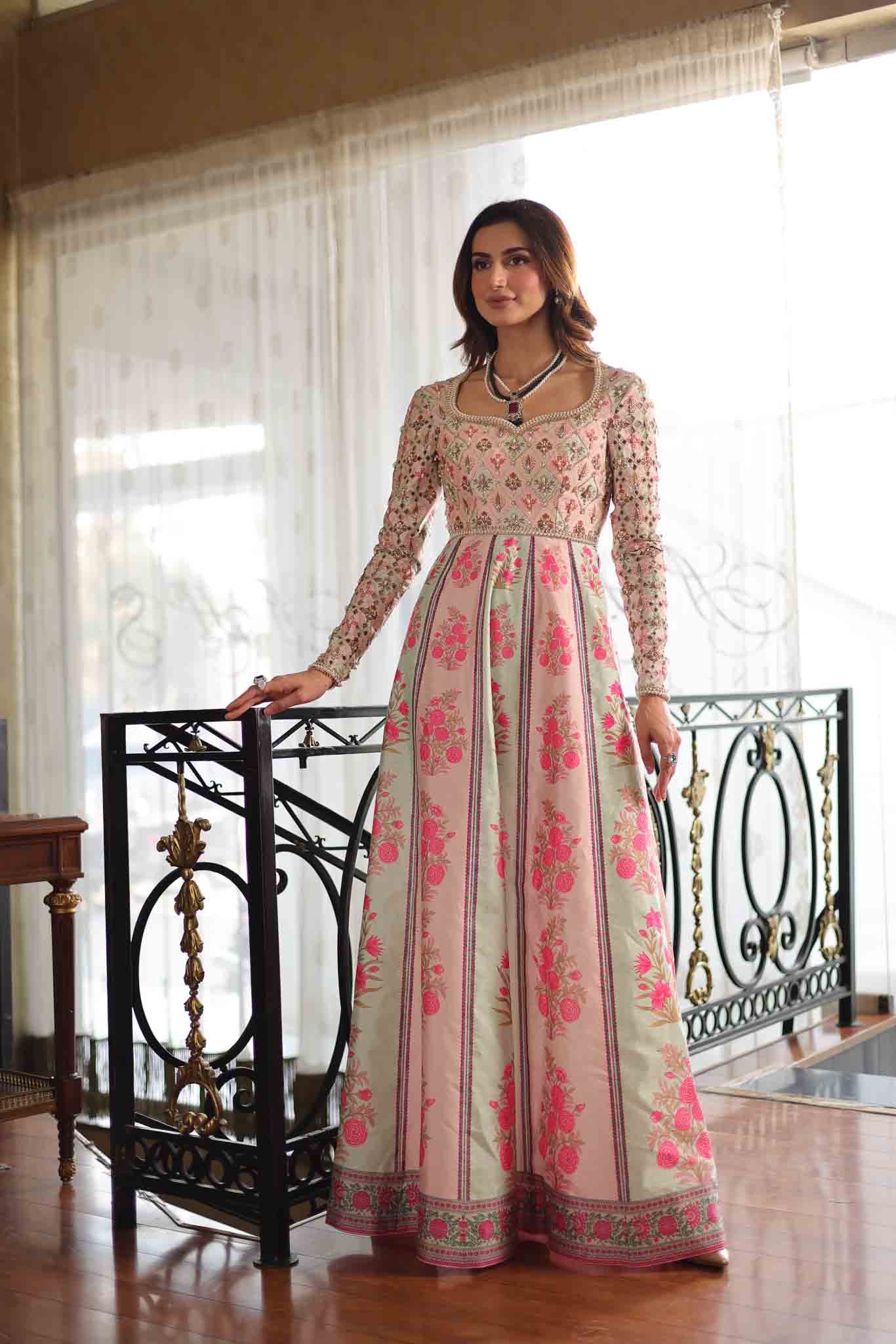 Model wearing pastel pink and ivory floral printed long dress from Mysie By Tahira's Gulabo, Pakistani Luxury pret and clothes online in UK.