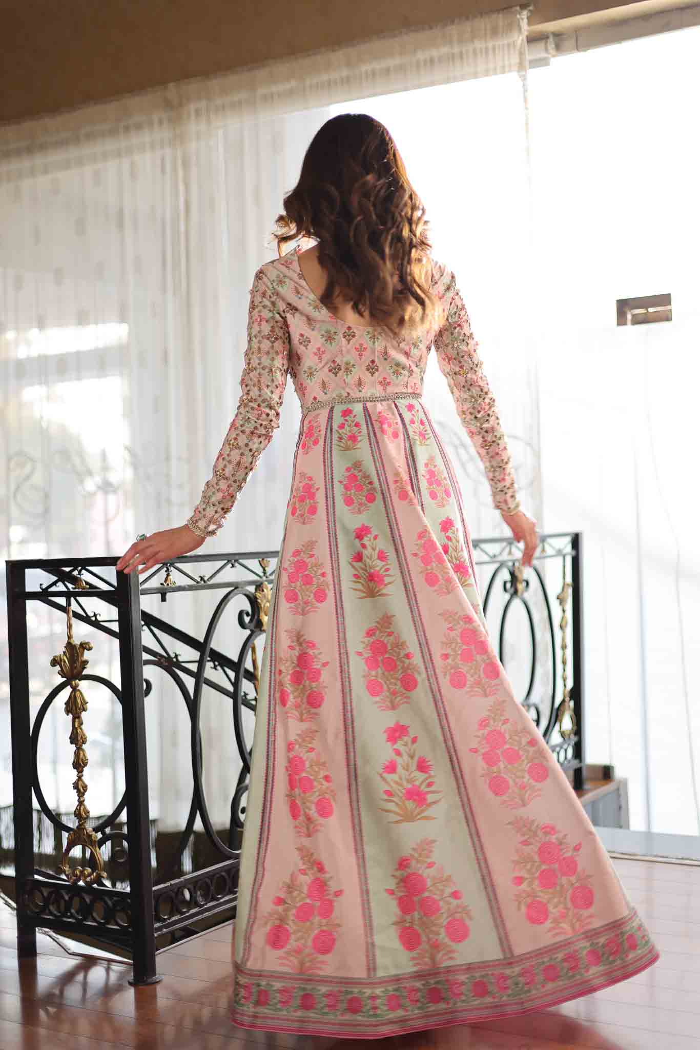 Model wearing pastel pink and ivory floral printed long dress from Mysie By Tahira's Gulabo, Pakistani Luxury pret and clothes online in UK.