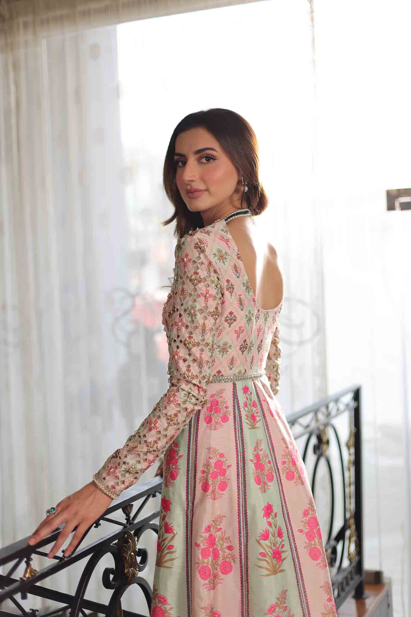 Model wearing pastel pink and ivory floral printed long dress from Mysie By Tahira's Gulabo, Pakistani Luxury pret and clothes online in UK.
