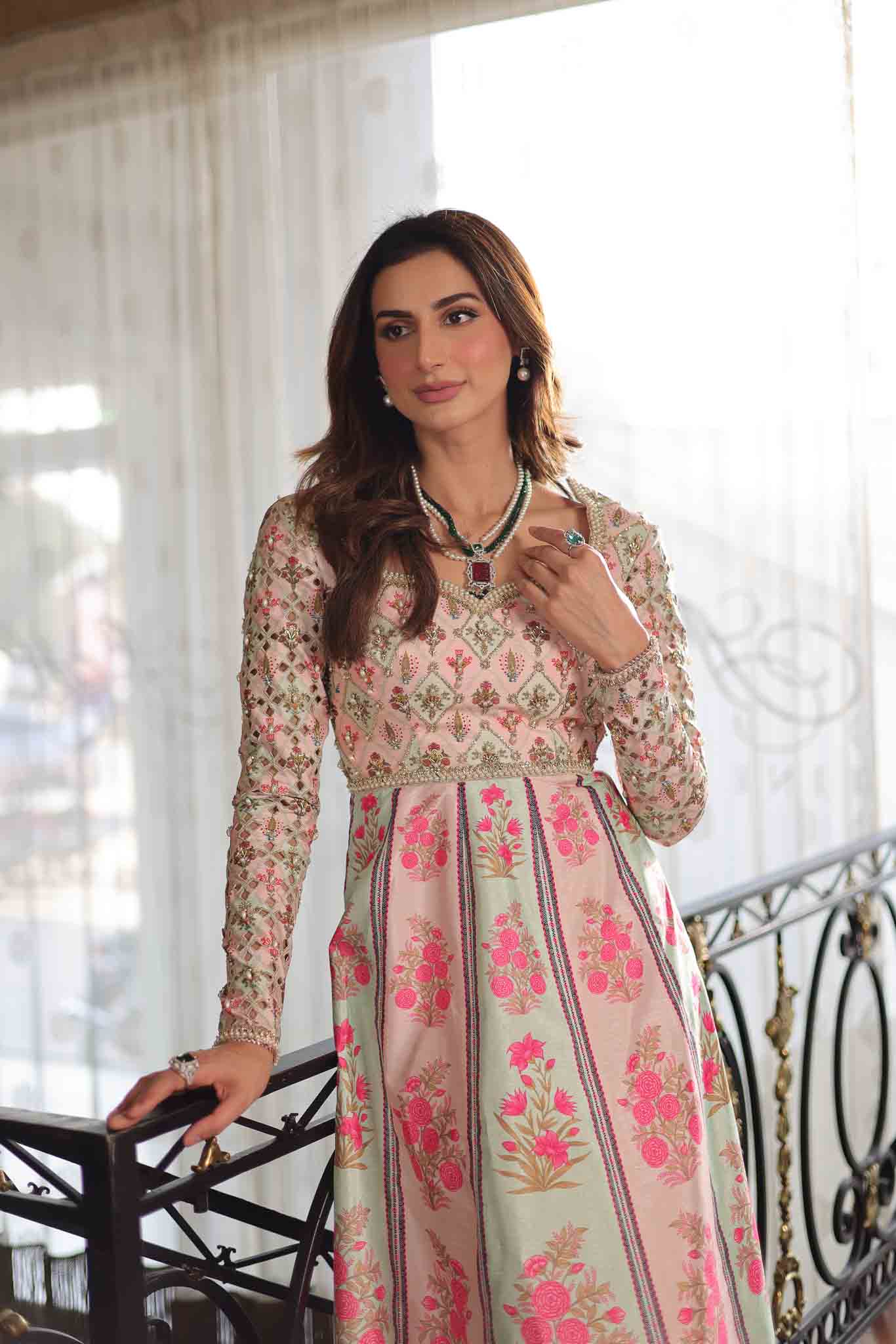 Model wearing pastel pink and ivory floral printed long dress from Mysie By Tahira's Gulabo, Pakistani Luxury pret and clothes online in UK.