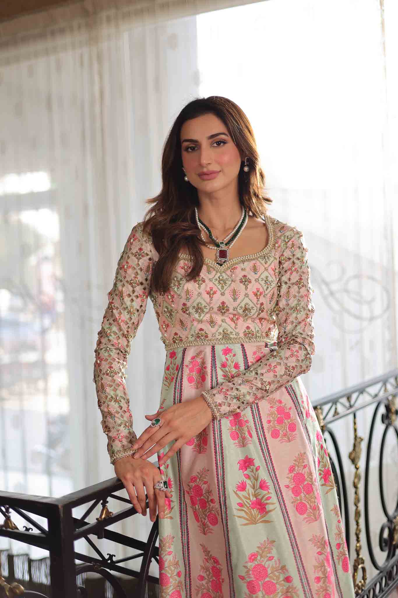 Model wearing pastel pink and ivory floral printed long dress from Mysie By Tahira's Gulabo, Pakistani Luxury pret and clothes online in UK.